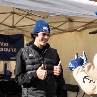 An alum giving Louie the Laker a thumbs up.